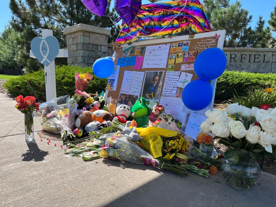 A memorial to 10-year-old Oliver Stratton, who was killed in an Aug. 2 crash near the intersection, is displayed at the southeast corner of River Pass Road and Saddle Horn Drive in Timnath on Aug. 4, 2023.