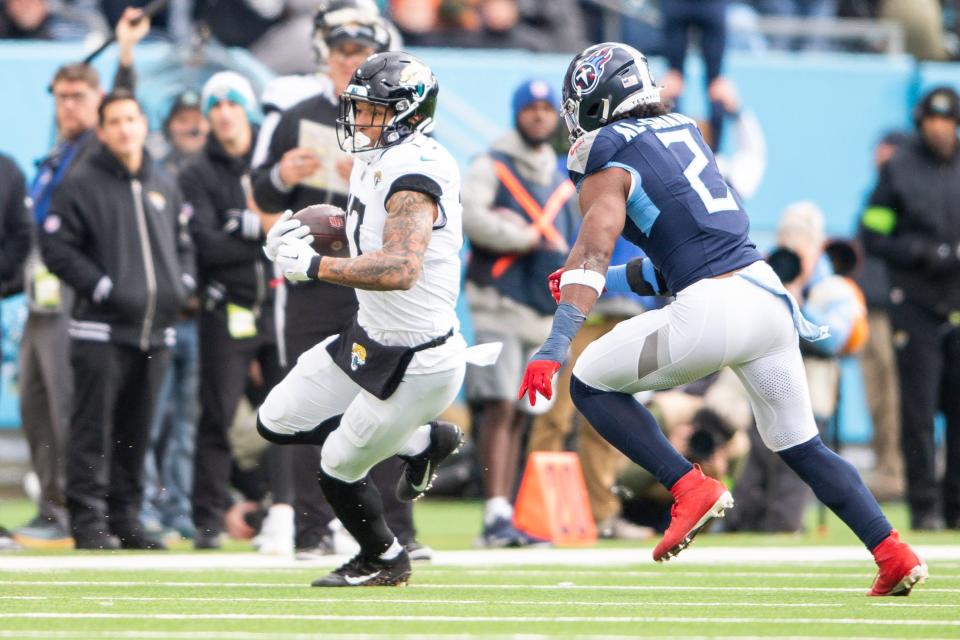 Jan 7, 2024; Nashville, Tennessee, USA; Jacksonville Jaguars tight end Evan Engram (17) runs the ball against the Tennessee Titans during the first half at Nissan Stadium. Mandatory Credit: Steve Roberts-USA TODAY Sports