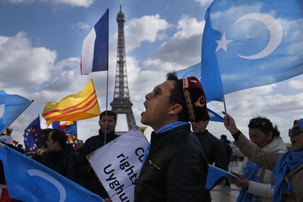 File photo:  A protester of the French Uyghur Community shouts slogans during a demonstration over China’s human rights record in Paris, France, 25 March 2019  (AFP via Getty Images)
