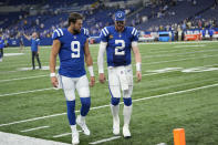 Indianapolis Colts quarterback Carson Wentz (2) walks off the filed with quarterback Jacob Eason (9) following an NFL football game against the Los Angeles Rams, Sunday, Sept. 19, 2021, in Indianapolis. Los Angeles won 27-24. (AP Photo/AJ Mast)