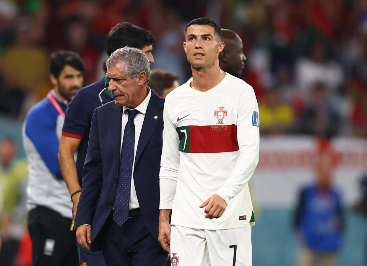 Soccer Football - FIFA World Cup Qatar 2022 - Group H - South Korea v Portugal - Education City Stadium, Al Rayyan, Qatar - December 2, 2022  Portugal's Cristiano Ronaldo with coach Fernando Santos after being substituted REUTERS/Matthew Childs