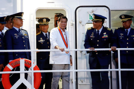 Philippines President Rodrigo Duterte visits the newly inaugurated Japan's built patrol ship during the ceremony marking the anniversary of the Philippines Coast Guard in Manila, Philippines, October 12, 2016. REUTERS/Damir Sagolj