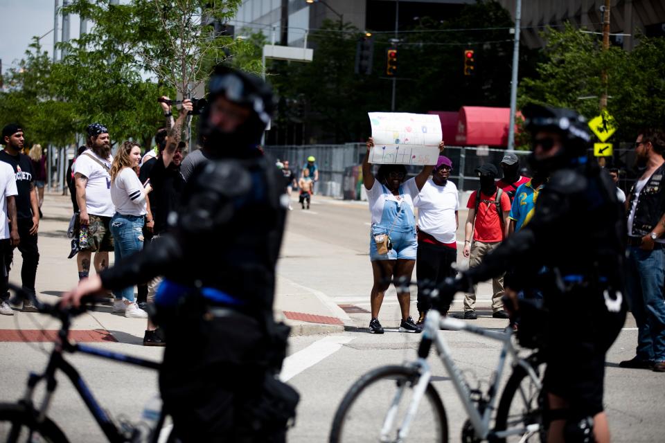 Protesters against the KKK hold signs outside the Honorable Sacred Knights of the Ku Klux Klan rally at the Montgomery Courthouse Square in Dayton, Ohio, on May 25, 2019.