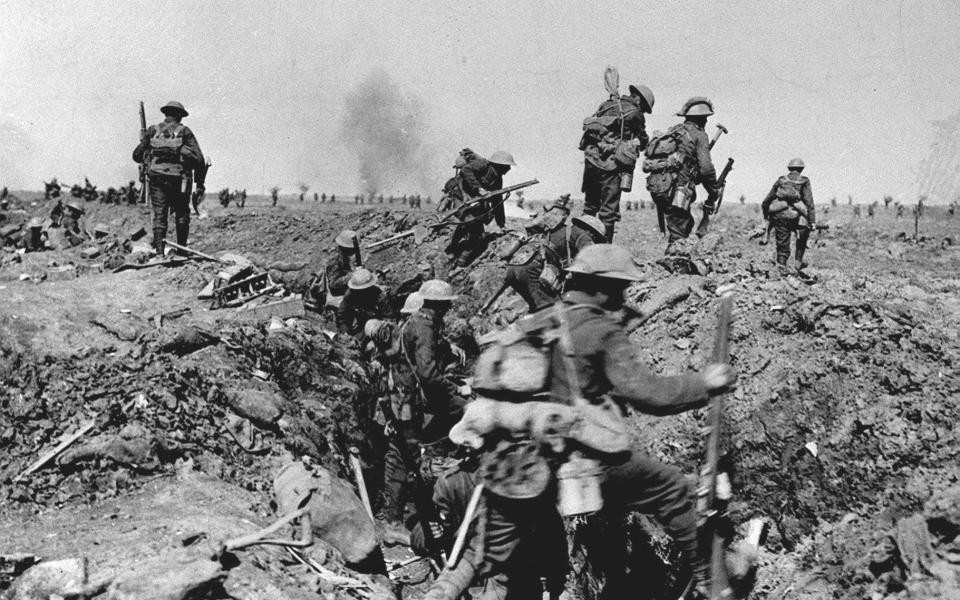 British troops negotiate a trench as they go forward in support of an attack on the village of Morval during the Battle of the Somme - PA