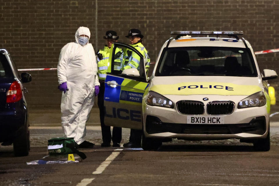 Forensics officers work at the scene of a shooting, the attack reportedly happened during a funeral at St Aloysius Church, in London, Britain, January 14, 2023. REUTERS/Henry Nicholls