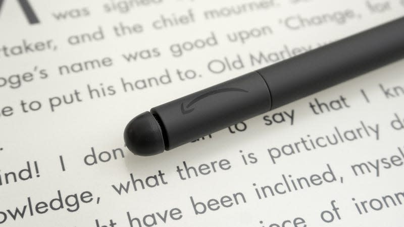 A close-up of the Kindle Scribe's Premium Pen stylus' eraser button on the end, sitting atop the Scribe's screen.