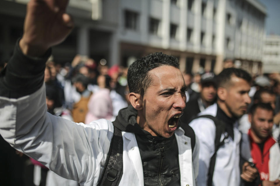 Protesting teachers chant slogans during a demonstration in Rabat, Morocco, Wednesday, Feb. 20, 2019. Moroccan police fired water cannons at protesting teachers who were marching toward a royal palace and beat people with truncheons amid demonstrations around the capital Wednesday. (AP Photo/Mosa'ab Elshamy)