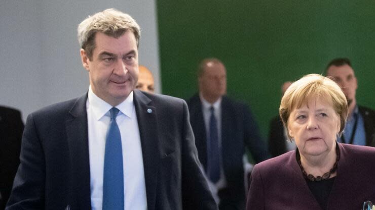 CSU-Chef und CDU-Chefin profitieren von ihrem Krisenmanagement in der Umfrage. Foto: dpa