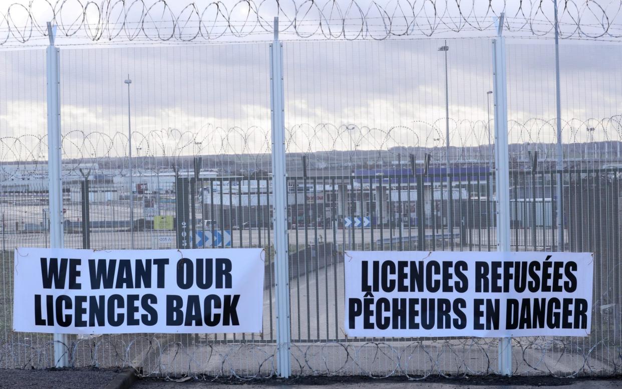 Banners installed by French fishermen on the fences of the Eurotunnel Freight Terminal near Calais earlier this year - Pascal Rossignol/Reuters