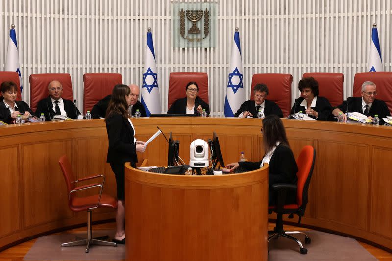 Israel's Supreme Court hears petitions against new law which limits conditions under which a premier can be removed from office