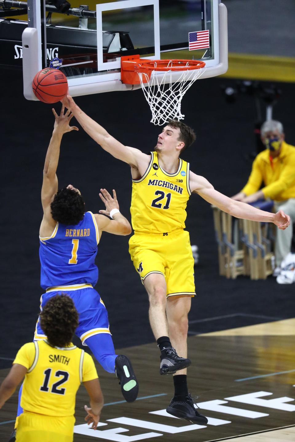 Michigan guard Franz Wagner blocks a shot by UCLA guard Jules Bernard during the first half of the Elite Eight game in the NCAA tournament on Tuesday, March 30, 2021, in Indianapolis.