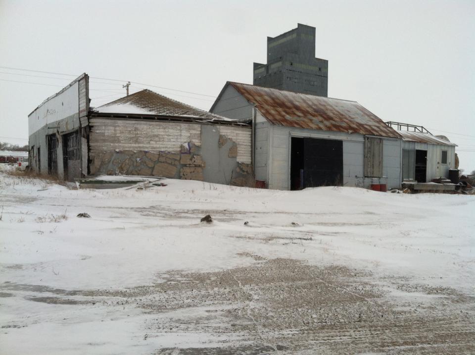 FILE - This March 3, 2014 file photo provided by the North Dakota Health Department is an abandoned building in Noonan, ND, where officials reported the illegal dumping of hundreds of radioactive oil filter socks, the tubular nets that strain liquids during the oil production process. North Dakota will pay for the cleanup of radioactive waste, according to documents obtained Thursday, March, 20, 2014 by The Associated Press shows. (AP Photo/North Dakota Health Department, File)