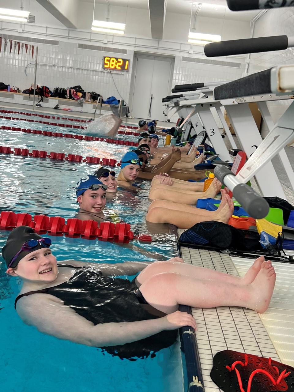 Heritage Christian's Chloe Salsbury competed at sectionals with spina bifida. She rolls her wheelchair to the pool deck, slips into the water and races.