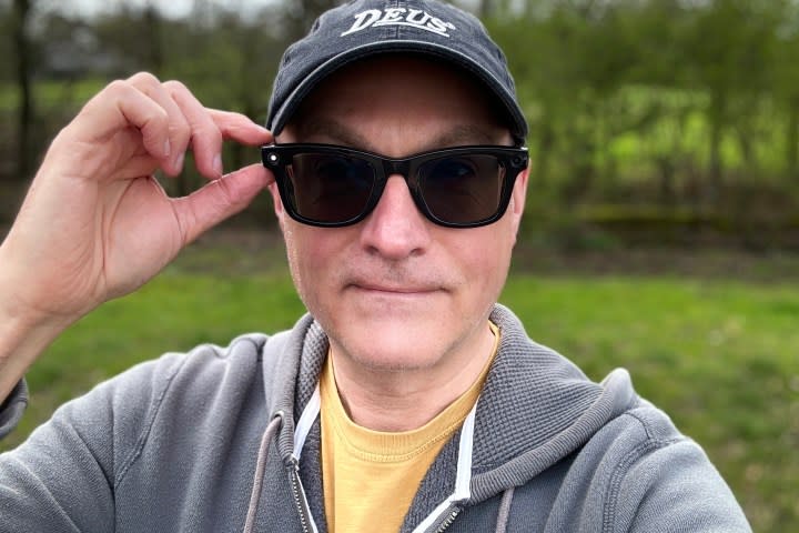 A person wearing the Ray-Ban Meta smartglasses, taking a photo.
