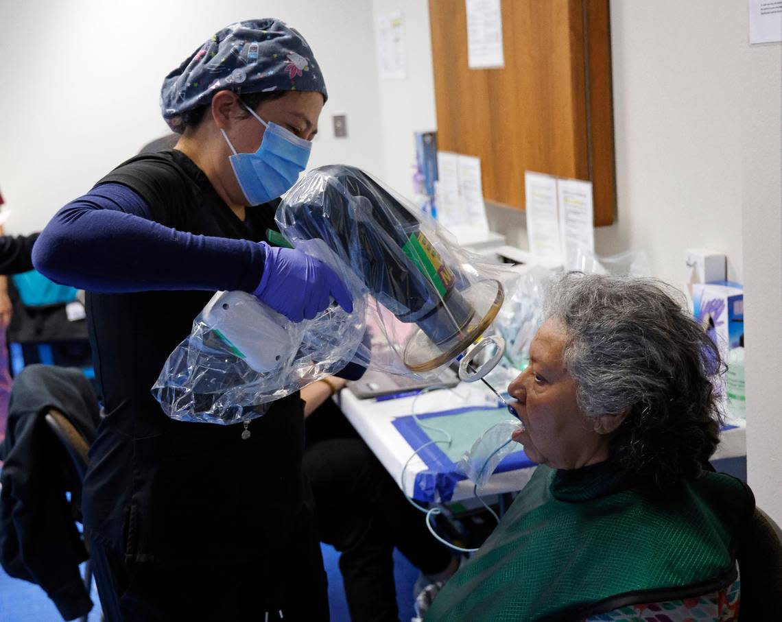 Claudia, a dental hygienist takes an X-ray of Gaby Gonzalez’s teeth at the Remote Area Medical Clinic at the Southwestern Baptist Theological Seminary in Fort Worth. The clinic is available to anyone who wished to use its services.