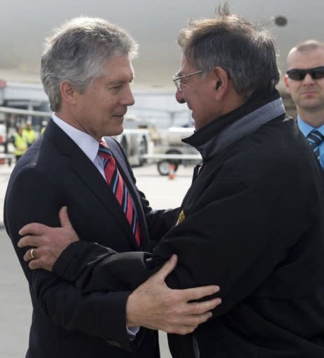 Australian Minister of Defense Stephen Smith (L) greets US Secretary of Defense Leon Panetta as he arrives at Perth International Airport in Perth. Panetta told reporters before flying into Perth that the Americans were ready to follow through on a plan to pivot to the Pacific despite crises in the Middle East and fiscal strains at home