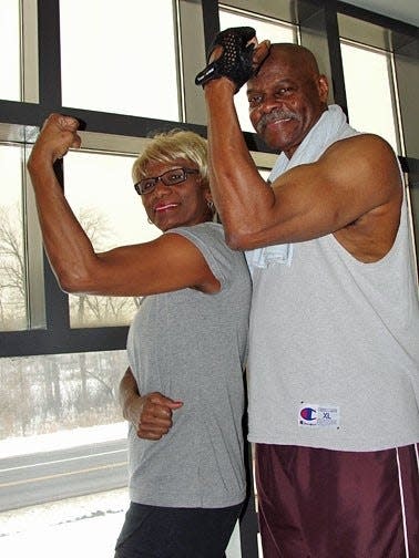 Betty Smith and her late husband, Mark, are shown during a workout session. Mark M. Smith, a retired pastor and former police officer, died from COVID in August.