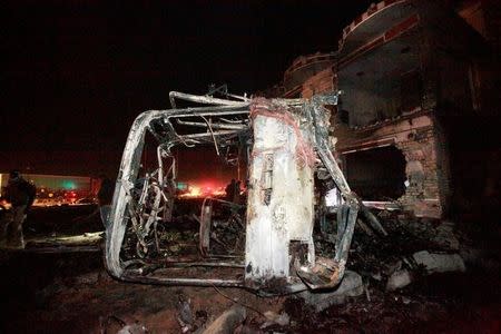 Destroyed vehicles are seen at the site of a suicide truck bomb attack, at a petrol station in the city of Hilla south of Baghdad, Iraq, November 24, 2016. REUTERS/Alaa Al-Marjani