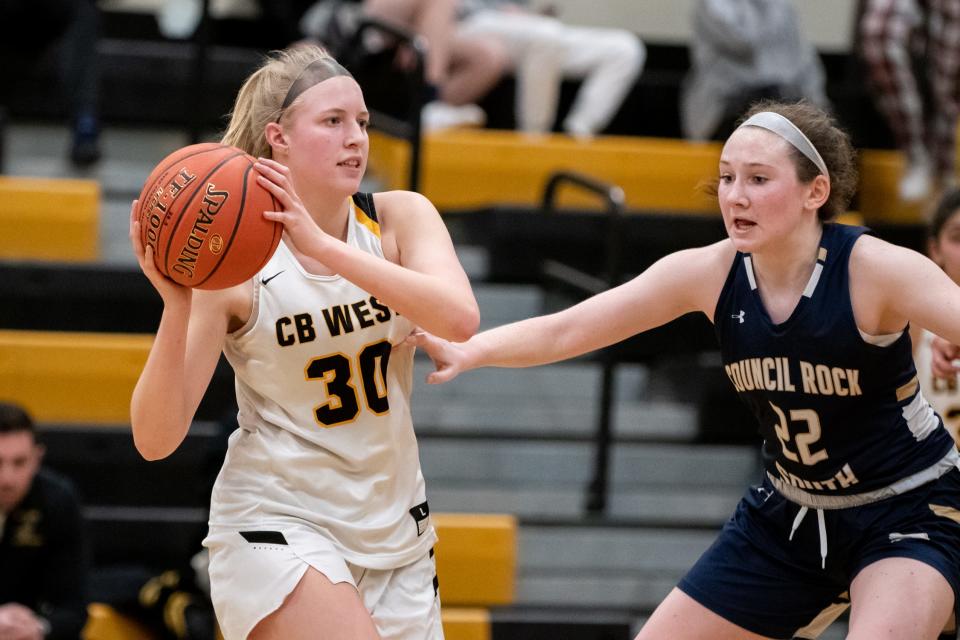 Central Bucks West's Ava Longo looks for an open teammate while guarded by Council Rock South's Fiona Reckner during a District One Class 6A first round playoff game at Central Bucks West on Friday, February 18, 2022. The Bucks advance to the second round after narrowly defeating the Golden Hawks 52-50.