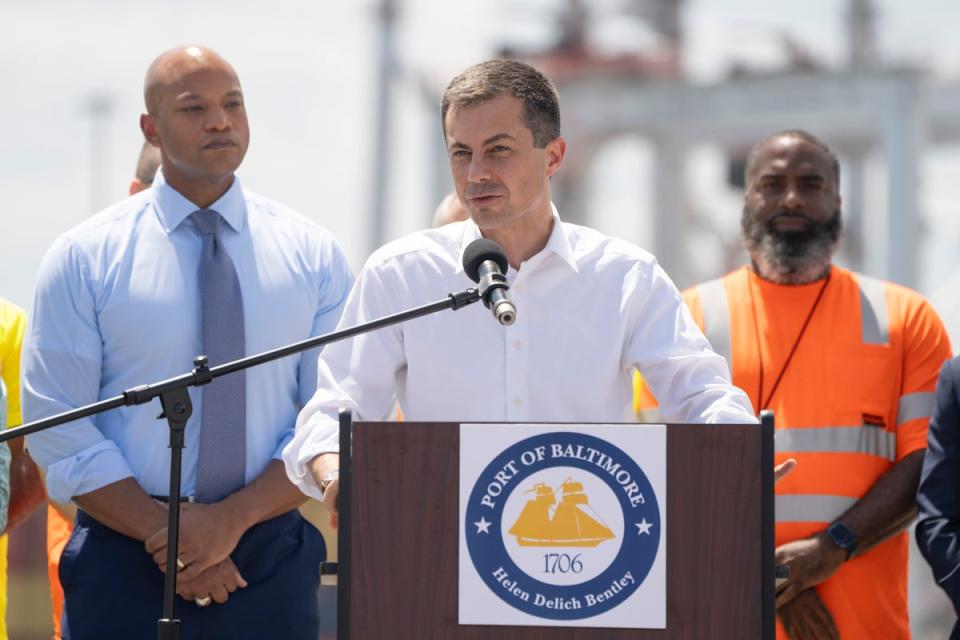 Transportation Secretary Pete Buttigieg, center, speaks during a news conference to mark the full reopening of the Port of Baltimore after the collapse of the Francis Scott Key Bridge in March, Wednesday, 12 June  2024 (AP)