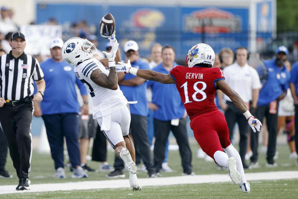 BYU wide receiver Keelan Marion (17) catches a 37-yard pass as Kansas cornerback Kalon Gervin (18) defends during the third quarter of an NCAA football game on Saturday, Sept. 23, 2023, in Lawrence, Kan. | Colin E. Braley, Associated Press