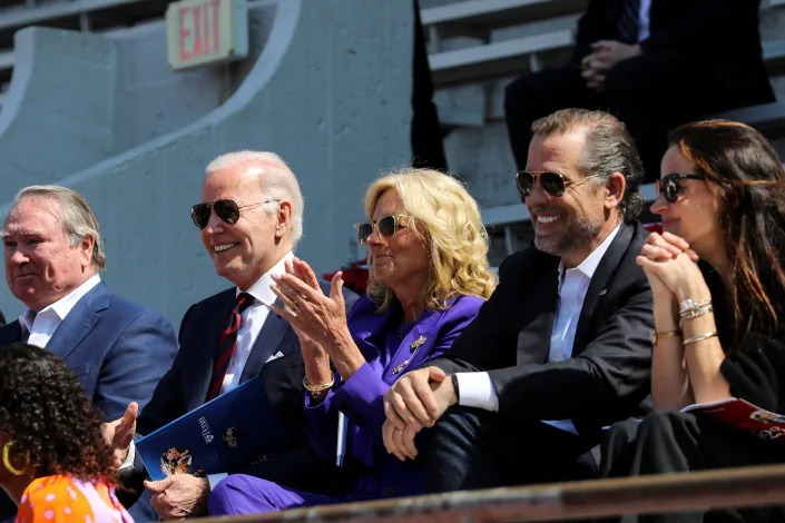 President Biden, Jill Biden, Hunter Biden, and Ashley Biden are seated together, facing the same direction, wearing sunglasses.