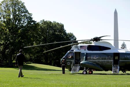 U.S. President Barack Obama walks on the South Lawn of the White House before his departure to view flood damaged area in Baton Rouge, in Washington, U.S., August 23, 2016. REUTERS/Yuri Gripas