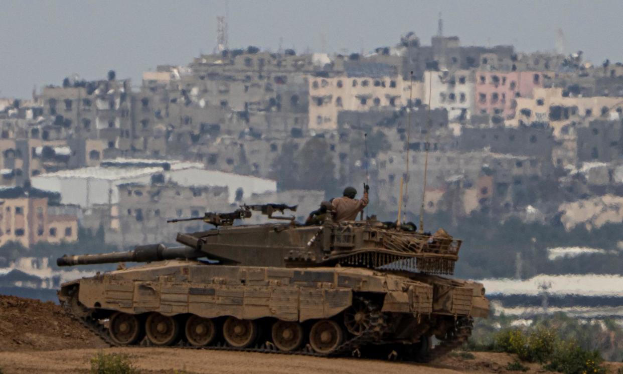 <span>An Israeli soldier in a tank on the border with Gaza on Sunday.</span><span>Photograph: Ariel Schalit/AP</span>