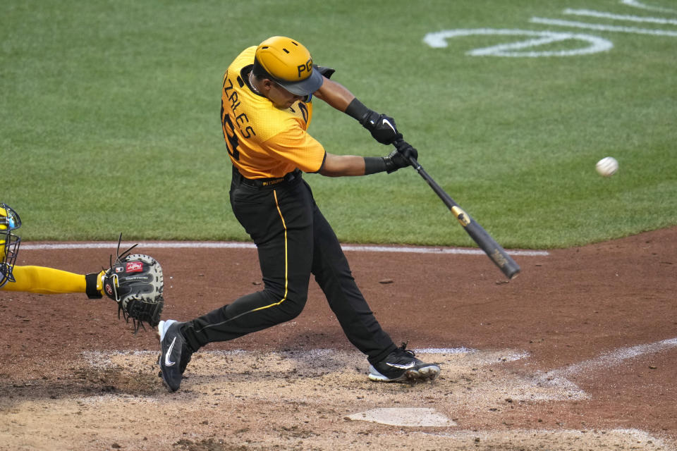 Pittsburgh Pirates' Nick Gonzales hits a two-run double off Milwaukee Brewers starting pitcher Freddy Peralta during the fourth inning of a baseball game in Pittsburgh, Friday, June 30, 2023. (AP Photo/Gene J. Puskar)