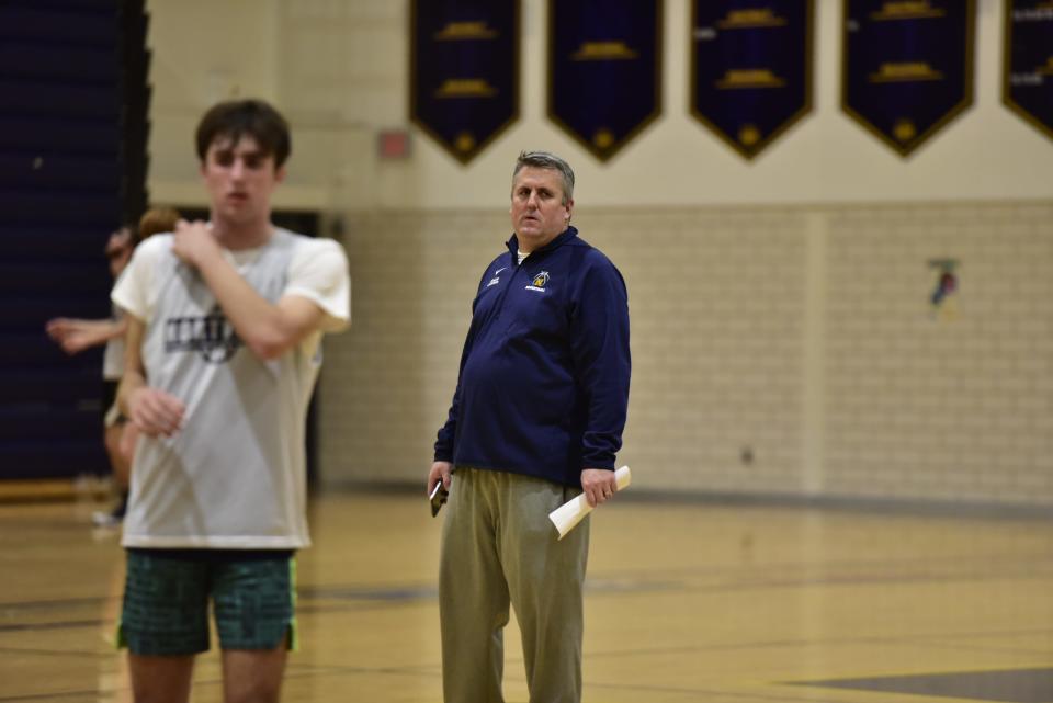 Port Huron Northern coach Brian Jamison watches his players run a drill during practice at Port Huron Northern High School on Tuesday.