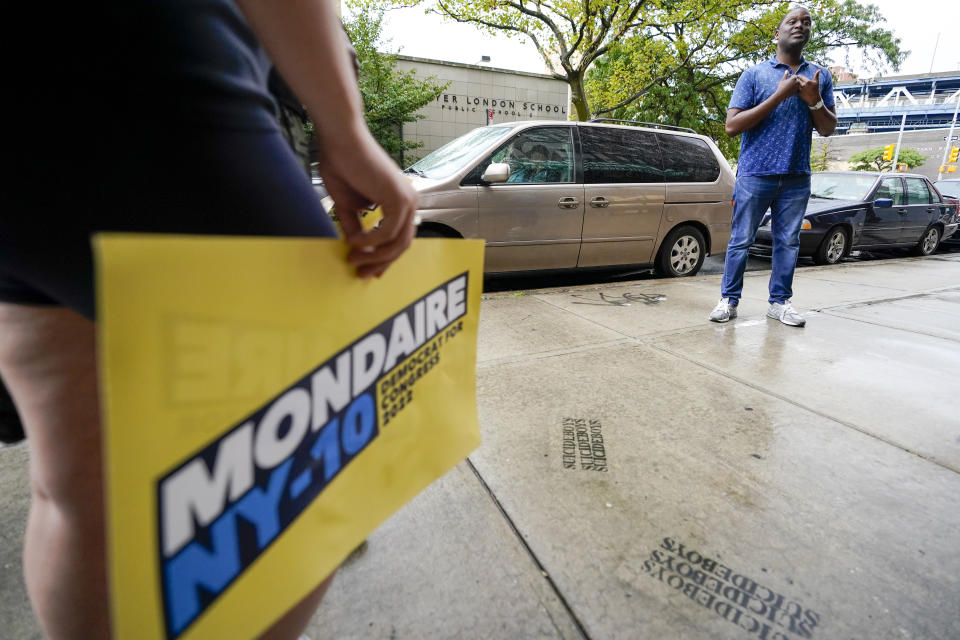 U.S. Rep. Mondaire Jones, D-N.Y., talks to campaign volunteers and staff during a canvass kick-off on the Lower East Side of Manhattan, Monday, Aug. 22, 2022, in New York. Jones is running in the crowded Democratic congressional primary for New York's 10th District. (AP Photo/Mary Altaffer)