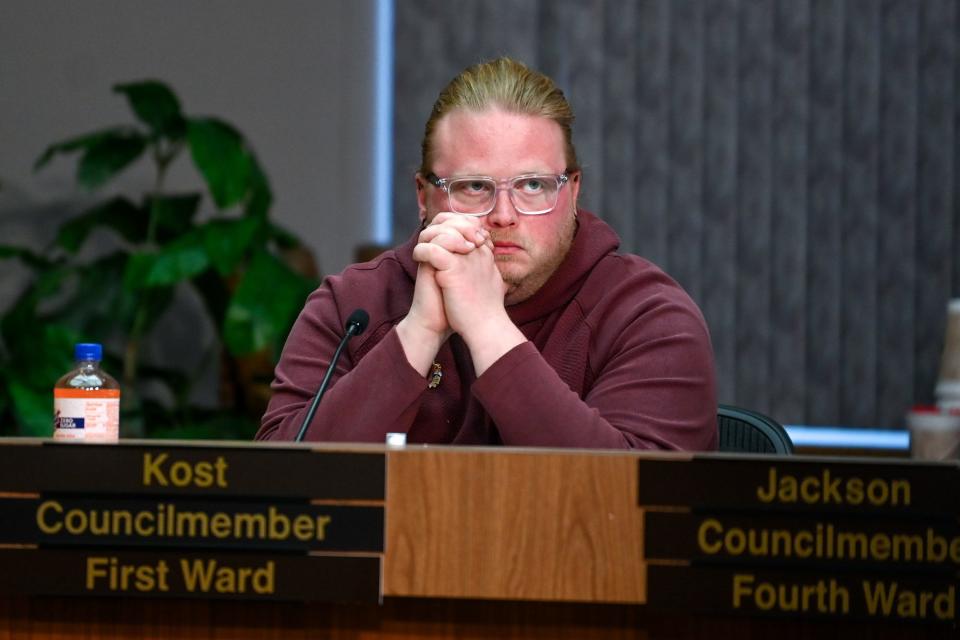 Lansing City Council member Ryan Kost listens during a special meeting on Monday, April 3, 2023, at City Hall in Lansing. Kost owes unpaid restitution from a traffic crash in 2009 and has been the subject of a personal protection order.