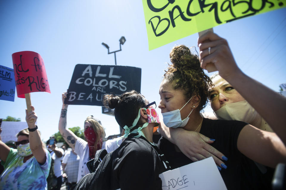 Makyla Bard, right, is comforted by other protesters in Decatur, Alabama, as she chants, "Say his name," during a peaceful protest May 31 over the police killing of George Floyd on May 25 in Minneapolis. (Photo: Dan Busey/The Decatur Daily via Associated Press)