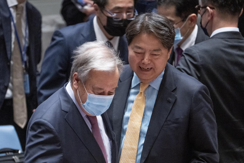 Hayashi Yoshimasa, Minister for Foreign Affairs of Japan, right, arrives with United Nations Secretary General Antonio Guterres before chairing a Security Council meeting at United Nations headquarters, Thursday, Jan. 12, 2023. (AP Photo/John Minchillo)