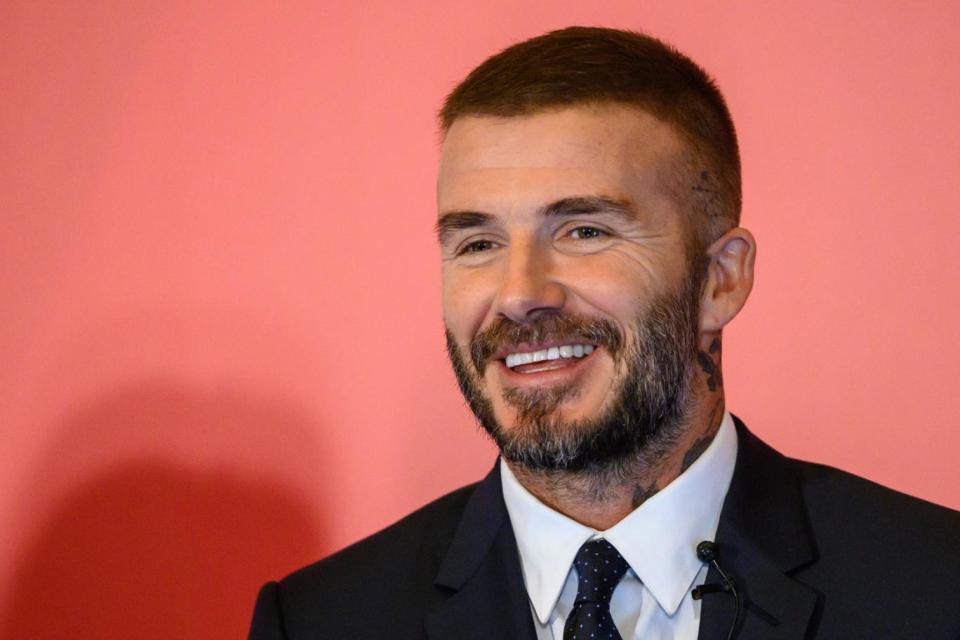 Transformation: Beckham's fuller head of hair (Anthony Wallace/AFP/Getty)