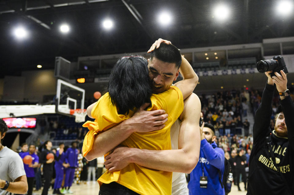 Purdue center Zach Edey (15) celebrates with his mother after Purdue defeated Alabama 92-86 in an NCAA college basketball game in Toronto, Saturday, Dec. 9, 2023. (Christopher Katsarov/The Canadian Press via AP)