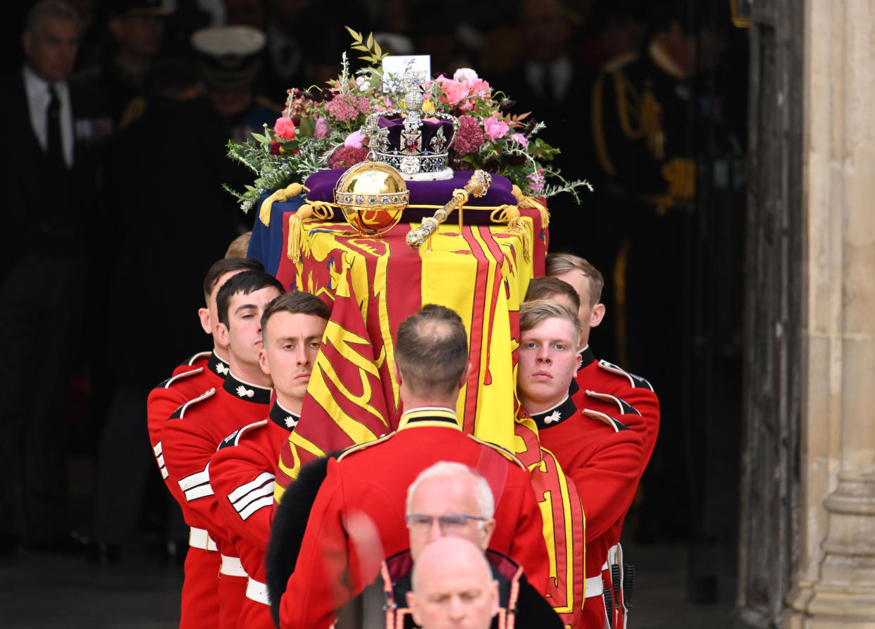 LONDON, ENGLAND - SEPTEMBER 19: HM Queen Elizabeth's coffin is carried out of the doors of Westminster Abbey during The State Funeral Of Queen Elizabeth II at Westminster Abbey on September 19, 2022 in London, England. Elizabeth Alexandra Mary Windsor was born in Bruton Street, Mayfair, London on 21 April 1926. She married Prince Philip in 1947 and ascended the throne of the United Kingdom and Commonwealth on 6 February 1952 after the death of her Father, King George VI. Queen Elizabeth II died at Balmoral Castle in Scotland on September 8, 2022, and is succeeded by her eldest son, King Charles III. (Photo by Karwai Tang/WireImage)