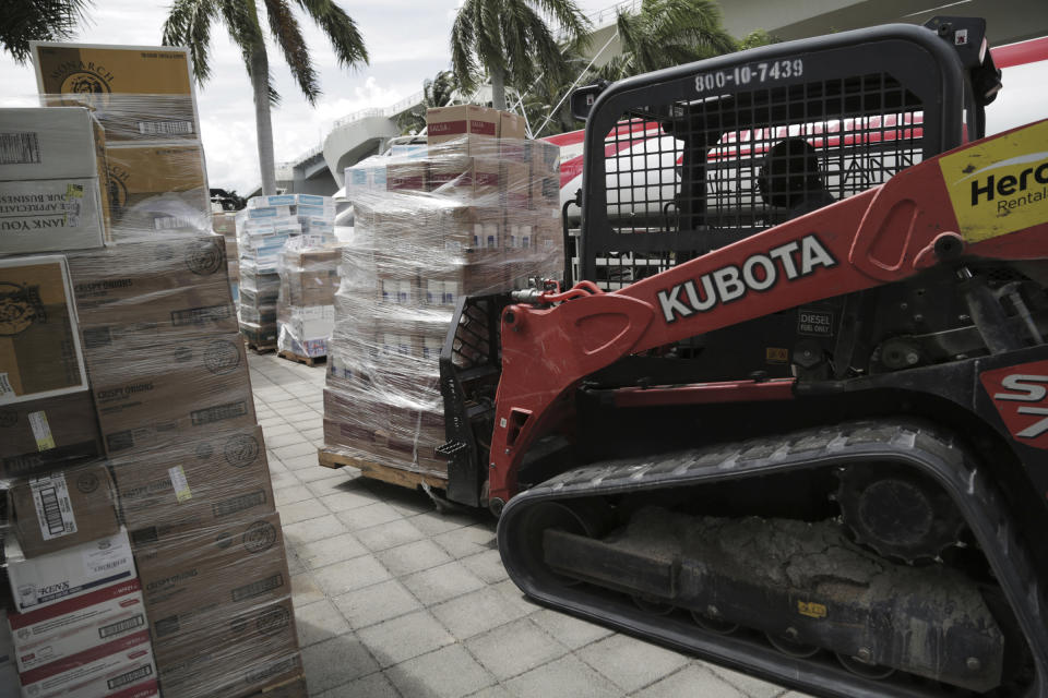 Hurricane relief supplies are ready to be loaded on the "Globe" a ship that will make the trek to the Bahamas with much needed help Wednesday, Sept. 4, 2019, in Fort Lauderdale, Fla. Chef José Andres' World Central Kitchens is loading up the vessel with the supplies for the victims of Hurricane Dorian that devastated the Bahamas. (Jose A. Iglesias/Miami Herald via AP)