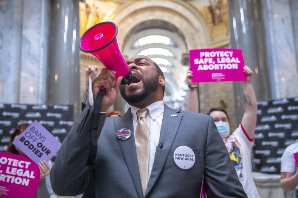 FILE - Charles Booker, a candidate for U.S. Senate, joins protesters at the Kentucky state Capitol in Frankfort, Ky., on April 13, 2022. The future of abortion access in Kentucky could hinge on a constitutional question on the ballot Nov. 8. Kentucky voters will decide whether to amend the state constitution to declare it doesn’t protect the right to an abortion. (Ryan C. Hermens/Lexington Herald-Leader via AP, File)