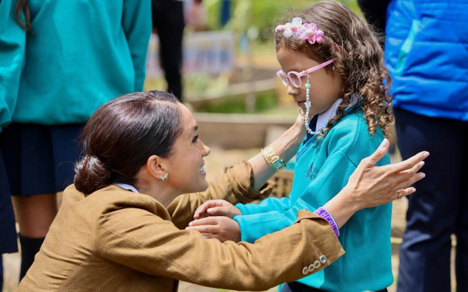 The Duchess of Sussex wore a pair earrings that had belonged to the late Princess Diana on day two of the tour