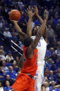 Kentucky's Ashton Hagans, right, shoots while pressured by Auburn's Anfernee McLemore during the first half of an NCAA college basketball game in Lexington, Ky., Saturday, Feb. 29, 2020. (AP Photo/James Crisp)