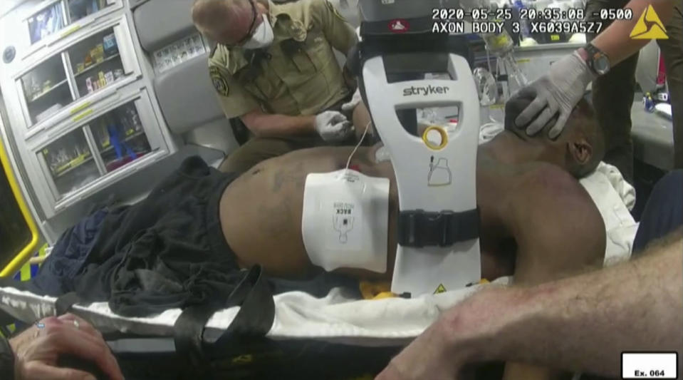 FILE - In this image from police body camera video, emergency personal tend to George Floyd after he had been loaded into an ambulance on May 25, 2020, in Minneapolis. In a statement posted on the National Association of Medical Examiners’ site on March 23, 2023, the leading group of medical experts says the term “excited delirium”should not be listed as a cause of death. Critics have said the term has been used to justify excessive force by police. The term came upduring the 2021 trial of former Minneapolis police officer Derek Chauvin,whom jurors convicted in the death of Floyd. (Minneapolis Police Department via AP, File)