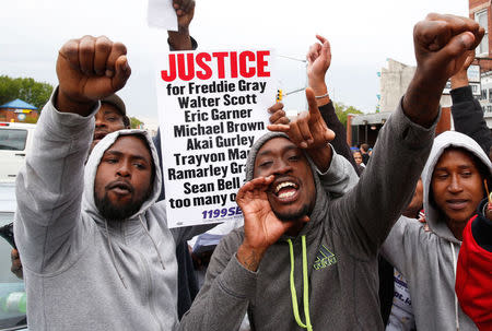 People celebrate as they gather in the streets following the decision to charge six police officers in Baltimore, May 1, 2015. REUTERS/Lucas Jackson