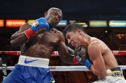 Timothy Bradley, left, connects against Jessie Vargas during their June bout. (AP)