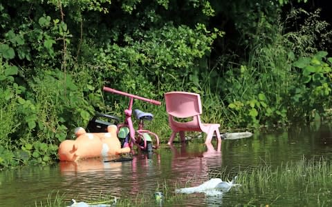 Abandoned children's toys in Wainfleet where more than two months' worth of rain fell in just two days - Credit: &nbsp;Danny Lawson/PA