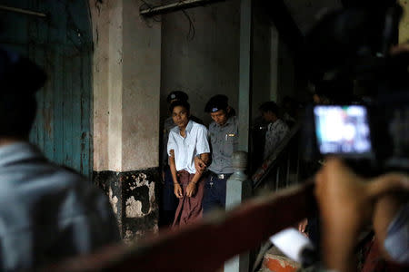 Detained Reuters journalist Kyaw Soe Oo leaves after a court hearing in Yangon, Myanmar May 29, 2018. REUTERS/Ann Wang