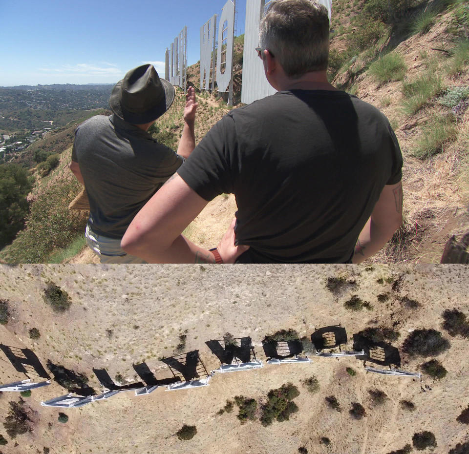 Jeff Zarrinnam gives Luke Burbank a closeup view of the Hollywood sign.  / Credit: CBS News