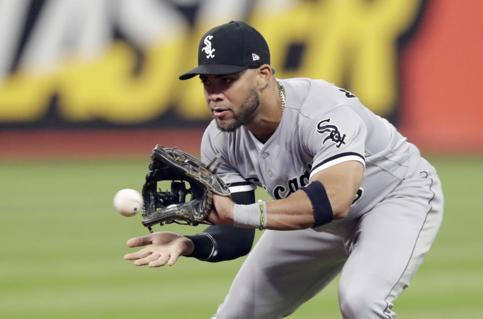 Chicago White Sox's Yoan Moncada fields a ball hit by Cleveland Indians' Melky Cabrera in the fourth inning of a baseball game, Wednesday, Sept. 19, 2018, in Cleveland. Cabrera was out on the play. (AP Photo/Tony Dejak)