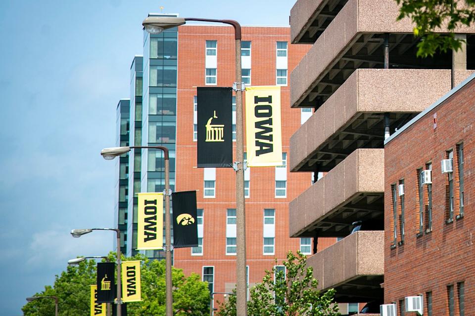 University of Iowa banners hang from light poles along Madison Street, Wednesday, Aug. 11, 2021, in Iowa City, Iowa.