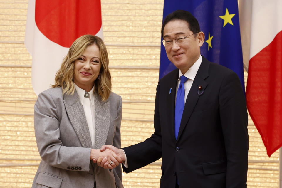 Italian Prime Minister Giorgia Meloni and her Japanese counterpart Fumio Kishida, right, pose for the cameras during a Japan-Italy bilateral meeting at Japan's prime minister office in Tokyo, Monday, Feb. 5, 2024. (Rodrigo Reyes Marin, Pool via AP)